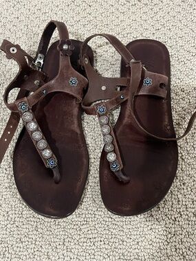 Women’s Brown Embellished T-Strap Sandals with evil eyes.